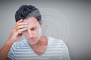 Composite image of upset man with hand on forehead