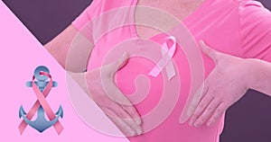 Composite image of woman with breast cancer awareness ribbon