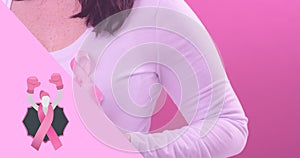 Composite image of woman with breast cancer awareness ribbon against pink background, copy space