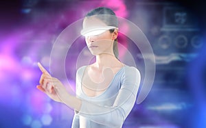 Composite image of woman pointing while using virtual video glasses