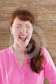 Composite image of woman shouting towards the camera