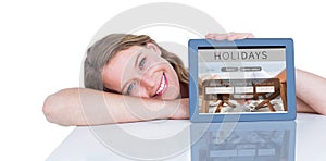 Composite image of woman showing tablet pc