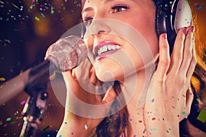 Composite image of woman singing in bar