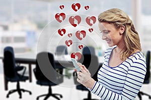 Composite image of woman using mobile phone