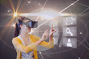 Composite image of woman using virtual reality