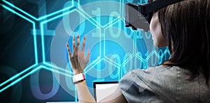 Composite image of woman using a virtual reality device