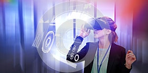 Composite image of young businesswoman using virtual reality glasses