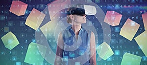 Composite image of young businesswoman wearing virtual reality glasses