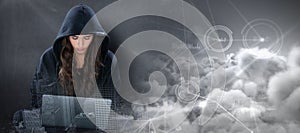 Composite image of young female hacker using laptop while sitting