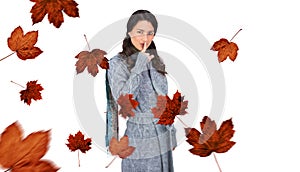 Composite image of young model with winter clothes keeping secret