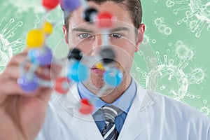 Composite image of young scientist experimenting molecule structure 3d