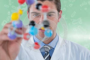 Composite image of young scientist experimenting molecule structure 3d