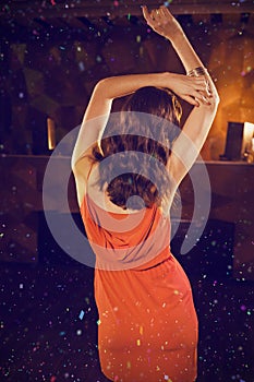 Composite image of young woman dancing on dance floor