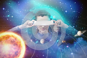 Composite image of young woman experiencing virtual reality simulator 3d