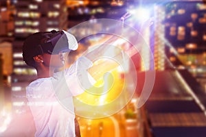 Composite image of young woman gesturing while using virtual reality simulator