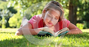 Composite image of young woman looking at a microscope slide