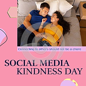 Composite of social media kindness day text and caucasian young couple lying on bed at home