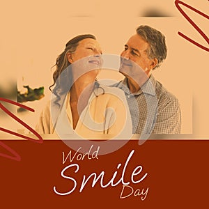 Composite of world smile day and caucasian couple smiling over arrow pattern on brown background