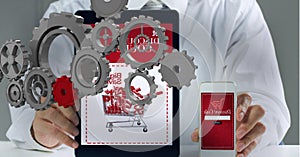 Composition of 3d cogs over midsection of businessman online shopping with tablet and smartphone