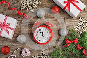 Composition with alarm clock on wooden background. Christmas countdown