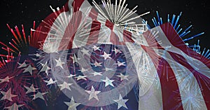 Composition of american flag billowing over red, white and blue fireworks in night sky