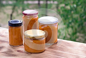 Composition of apricot jam cans cooked from berry harvest