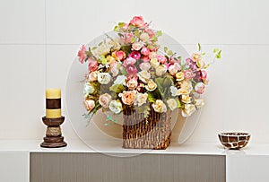 Composition with artificial flowers bouquet