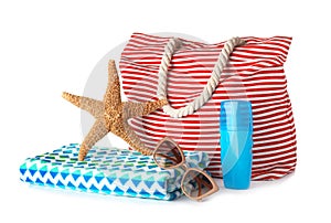 Composition with bag and beach accessories on white
