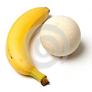 Composition with banana and plaster sphere on white background