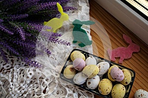 Composition With Beautiful Easter Eggs On Wooden Table.