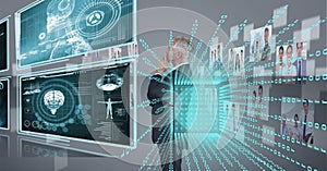 Composition of binary coding over businessman looking at screen with medical digital data