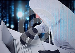 Composition of binary coding over hacker in hood and gloves using laptop