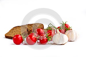 Composition of black bread slices, bunch of cherry tomatoes, gar