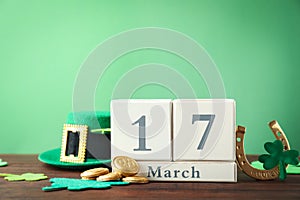 Composition with block calendar on table, space for text. St. Patrick`s Day celebration