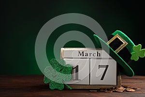 Composition with block calendar on table, space for text. St. Patrick`s Day celebration