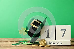 Composition with block calendar on table. St. Patrick`s Day celebration