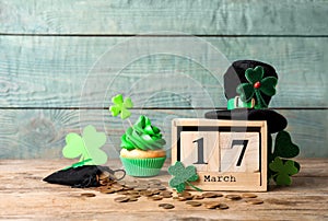 Composition with block calendar on table. St. Patrick`s Day celebration