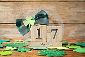 Composition with block calendar on table. St. Patrick`s Day celebration