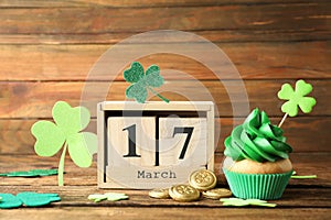 Composition with block calendar on table. St. Patrick`s Day celebration