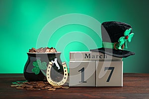 Composition with block calendar on table. St. Patrick`s Day celebration