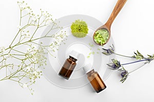 Composition with bottles of essential oils on white background. Natural cosmetics