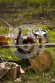 Composition of bottles of tinctures and ceramic bowls