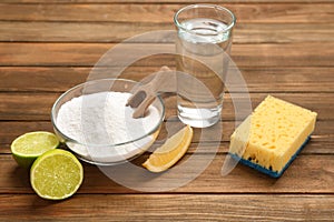 Composition with bowl of baking soda and glass of vinegar