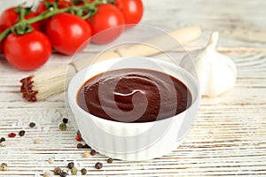 Composition with bowl of barbecue sauce