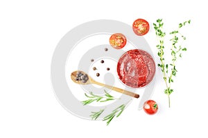 Composition of a bowl full of tomato sauce, spices, condiments