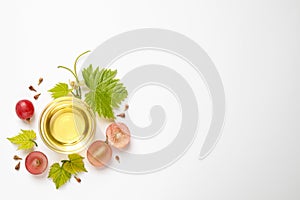 Composition with bowl of natural grape seed oil on background, top view. Organic cosmetic