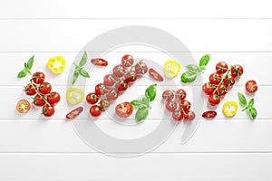 Composition of branches of ripe fresh cherry tomatoes with spices and mini bell peppers