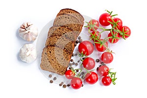 Composition of bread slices, bunch of cherry tomatoes and garlic