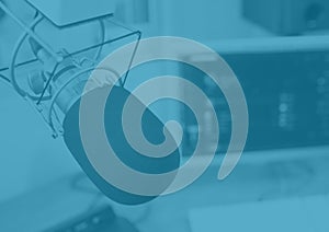 Composition of broadcasting microphone in radio studio on blue background