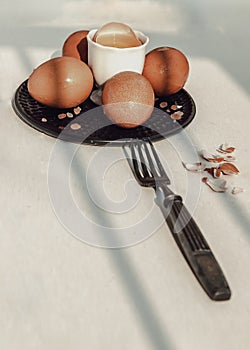 Composition of Broken fresh chicken egg Hen egg put at the middle of the fresh eggs with brown eggshell